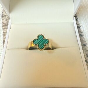 Gold Ring with Green Clover Design